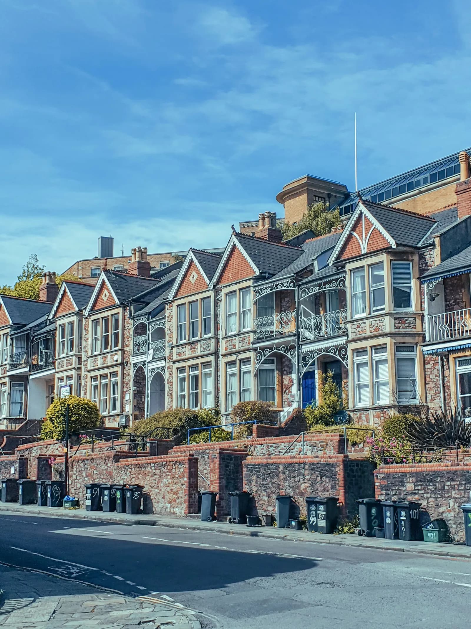 Victorian terraced houses with wheelie bins out on the pavement on collection day